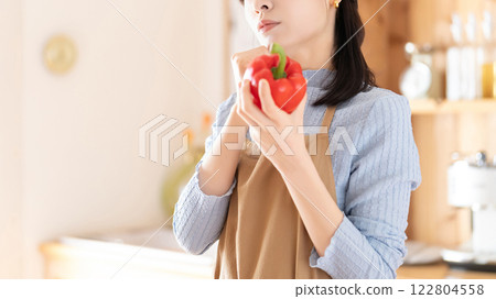 Woman thinking about menu in kitchen 122804558