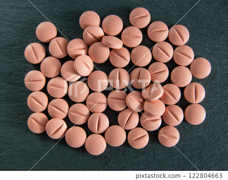 Medical pills and drugs on the black stone. Healthcare concept. 122804663
