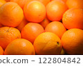 Fresh oranges beautifully lit on counter, close-up of vibrant citrus fruits with healthy nutrition concept perfect for food photography, summer fruit, organic, vitamin c rich, bright citrus freshness 122804842
