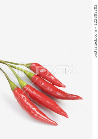 Red Chilli Peppers on Clean Background Red Chilli Peppers on Clean Background 122805202
