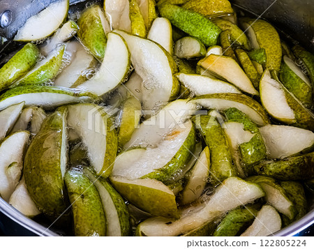 Sliced pieces of boiled pears with syrup 122805224