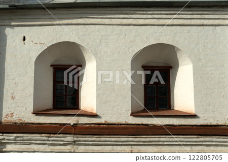 Vologda Kremlin. Small windows in the ancient walls of the Kremlin. Medieval fortifications. Vologda Kremlin. Small windows in the ancient walls of the Kremlin. Medieval fortifications. 122805705