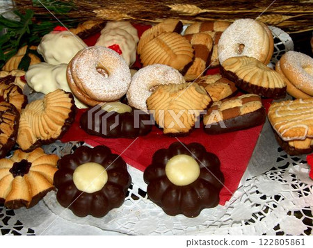 Baked Goods and Finger Food Presented on Natural Wood Tableware Baked Goods and Finger Food Presented on Natural Wood Tableware 122805861