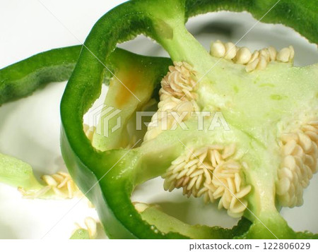Freshly Picked Edible Flower IngreSliced Green Bell Pepper with Seeds on White Background 122806029