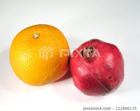 Orange and Pomegranate on White Background Orange and Pomegranate on White Background 122806135