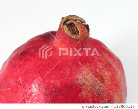 Close-Up of a Fresh Pomegranate on White Background 122806136