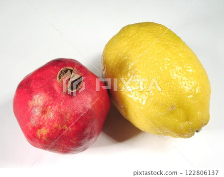 Pomegranate and Lemon on White Background Pomegranate and Lemon on White Background 122806137