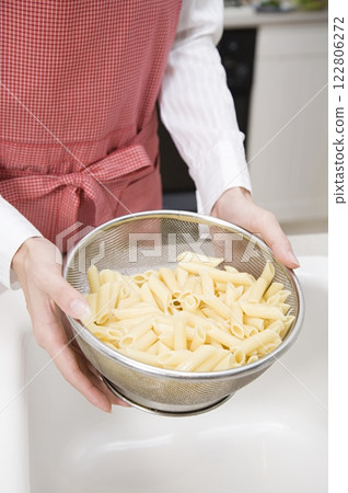 Person Draining Pasta, Background, Close View Background, Food Photography 122806272