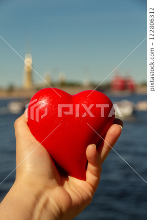 red heart n woman's palm on background of Peter and Paul Fortress in St. Petersburg, Russia red heart n woman's palm on background of Peter and Paul Fortress in St. Petersburg, Russia 122806312
