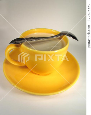 A cup of coffee on a table close view background 122806369