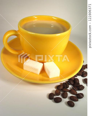 A cup of coffee on a table close view background 122806371