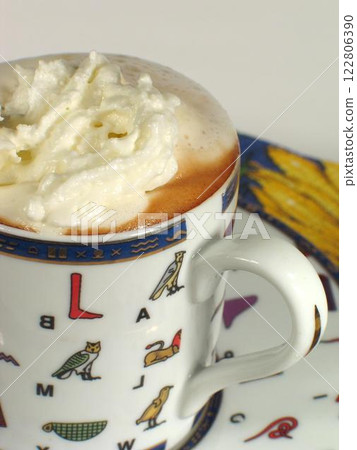 A cup of coffee on a table close view background A cup of coffee on a table close view background 122806390