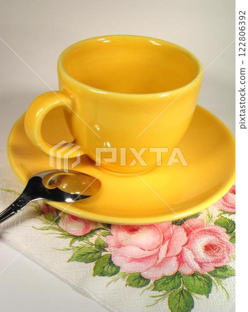 A cup of coffee on a table close view background A cup of coffee on a table close view background 122806392
