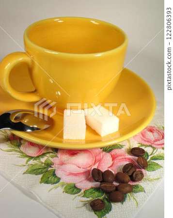 A cup of coffee on a table close view background A cup of coffee on a table close view background 122806393