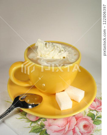 A cup of coffee on a table close view background 122806397