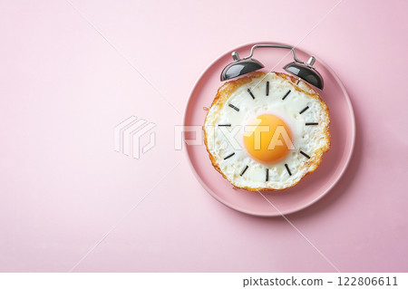 fried eggs in the form of an alarm clock, morning concept 122806611