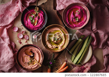 Vibrant Pink Hummus Spread with Microgreens 122807685