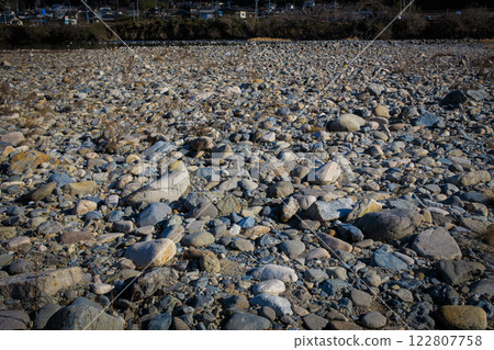 A stone rolling on the riverbank A stone rolling on the riverbank 122807758
