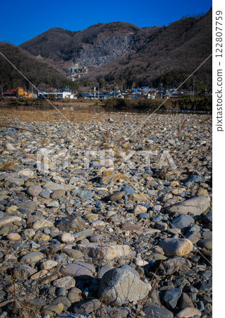 A stone rolling on the riverbank A stone rolling on the riverbank 122807759