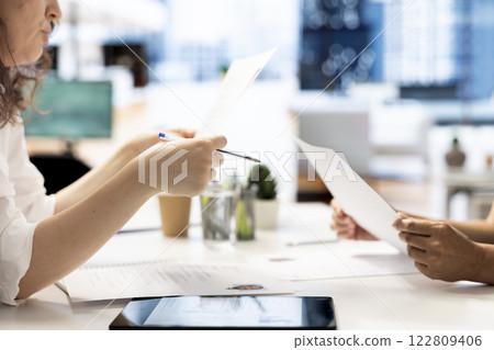 Motivated job interview candidate interested in career advancement, talking with human resources specialist. Close up of applicant discussing with employer, wishing to get hired for top level job 122809406