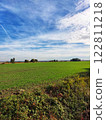 Green field of wheat against the sky 122811218