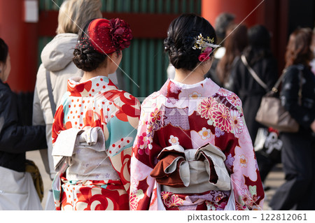 Young girl wearing Japanese kimono standing in front of Sensoji Temple in Tokyo, Japan. Kimono is a Japanese traditional garment. The word "kimono", which actually means a "thing to wear" 122812061