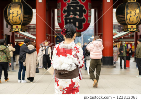Young girl wearing Japanese kimono standing in front of Sensoji Temple in Tokyo, Japan. Kimono is a Japanese traditional garment. The word "kimono", which actually means a "thing to wear" 122812063