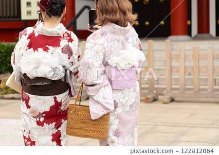 Young girl wearing Japanese kimono standing in front of Sensoji Temple in Tokyo, Japan. Kimono is a Japanese traditional garment. The word "kimono", which actually means a "thing to wear" 122812064