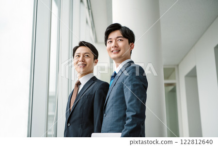 Portrait of two refreshing businessmen 122812640