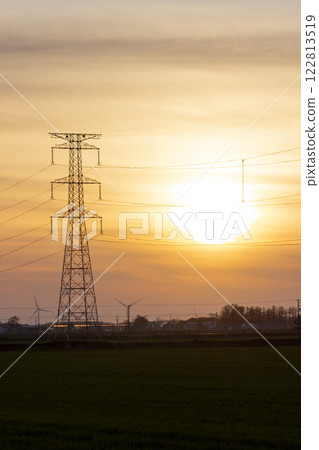 Sunset and electricity transmission tower 122813519