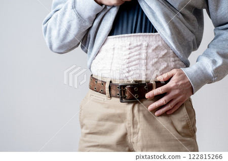 Men wearing belly bands, poor circulation, intestinal health, body parts 122815266