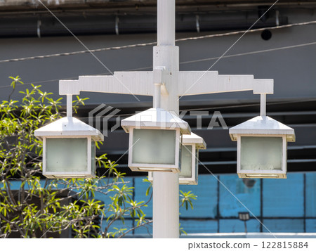Illuminated street lamps urban park daylight close-up modern design Illuminated street lamps urban park daylight close-up modern design 122815884