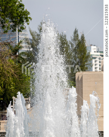 Fountain spray action urban park bright daylight close-up refreshing atmosphere 122815938