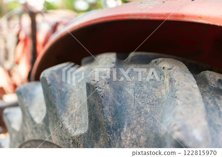 Tractor tire close-up farm location high-resolution image rural environment ground level viewpoint 122815970