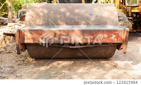 Construction equipment roller machine at work job site industrial environment ground level view 122815984