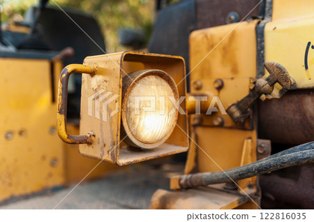 Industrial action close-up of construction machinery in urban setting 122816035