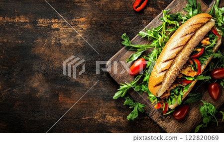 Banh mi - traditional Vietnamese sandwich on rustic background. Closeup view. Asian street food or takeaway. 122820069