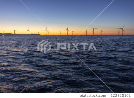 Hanawa Pier and offshore wind power tower at sunset 122820101