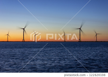 Hanawa Pier and offshore wind power tower at sunset 122820108