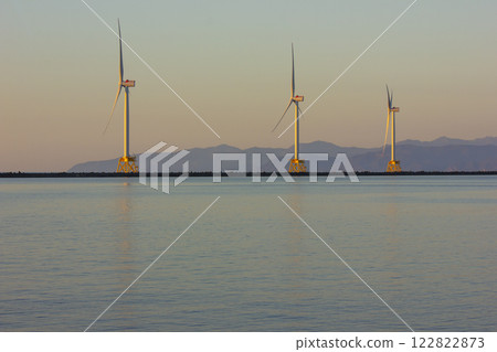 Ishikari Beach and wind power towers at dusk Ishikari Beach and wind power towers at dusk 122822873