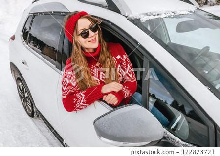 Woman Sitting in Car during Winter Road Trip Woman Sitting in Car during Winter Road Trip 122823721