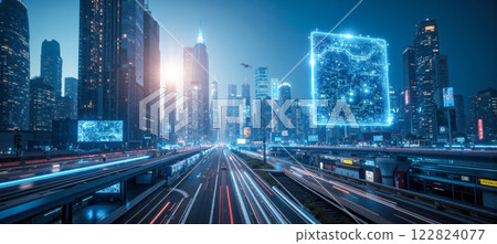 Nighttime view of futuristic city with tall, illuminated skyscrapers, glowing streetlights, and bustling roads, highlighting advanced urban infrastructure and modern architectural design 122824077