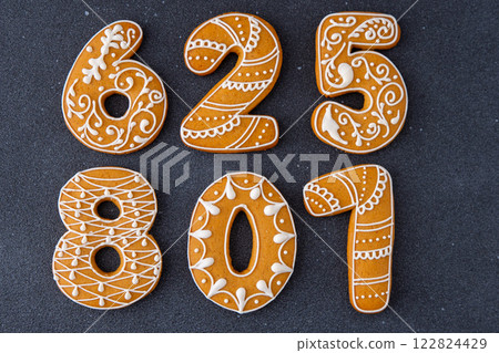 Iced Gingerbread Numbers Cookies Food background. Christmas decor. Iced Gingerbread Numbers Cookies Food background. Christmas decor. 122824429