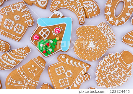 Gingerbread decorated with white sugar glaze. Food background. Christmas cookies. Gingerbread decorated with white sugar glaze. Food background. Christmas cookies. 122824445
