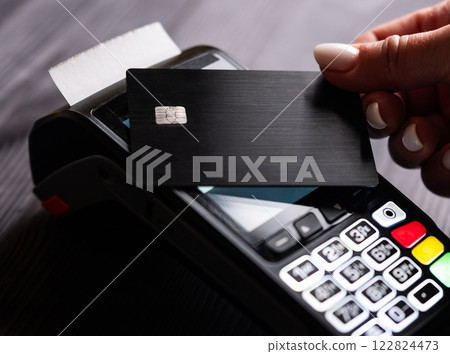 Girl Processes Payment By Paying With A Credit Card Using A Wireless Pos Terminal Girl Processes Payment By Paying With A Credit Card Using A Wireless Pos Terminal 122824473
