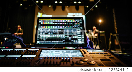 Professional sound and audio adjusting control screen and panel with buttons, sliders and display with night lights. Digital music record mixer monitor for the stage 122824545
