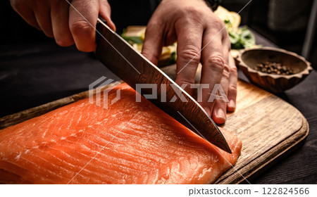 Chef Cutting Red Fish And Cooking A Fish Dinner In The Kitchen Chef Cutting Red Fish And Cooking A Fish Dinner In The Kitchen 122824566