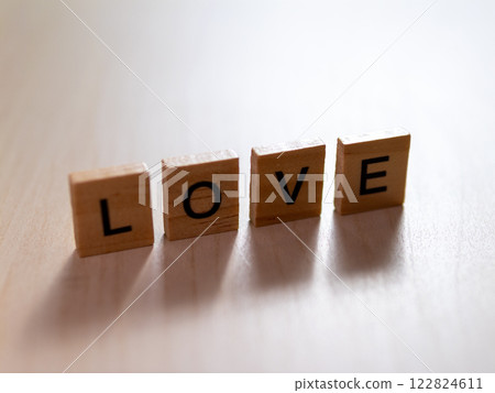 Love expression through wooden letters indoor setting minimalist style close-up view emotion concept Love expression through wooden letters indoor setting minimalist style close-up view emotion concept 122824611