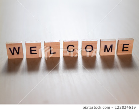 Warm welcome message displayed blocks cozy indoor setting inspirational decor unique perspective 122824619