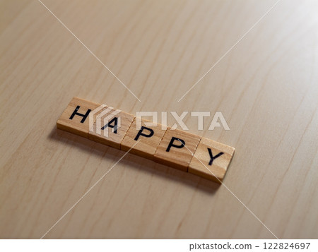 Celebrating joy happy letters a wooden table indoor setting close-up view positive vibes 122824697